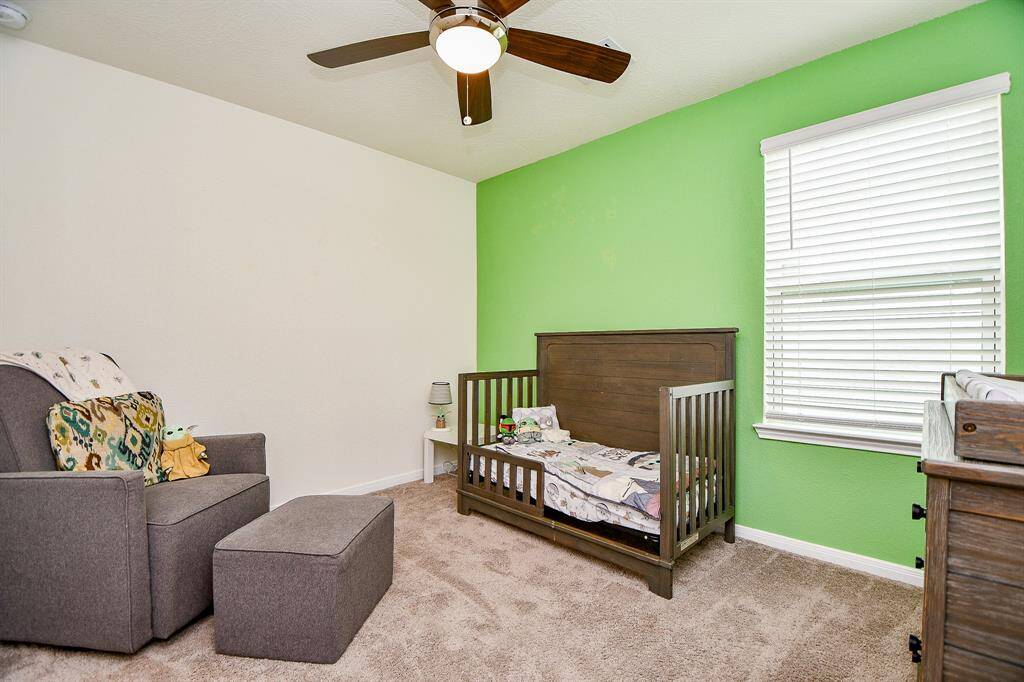 This cozy bedroom offers a comfortable space with a nice-sized closet, perfect for a variety of uses.