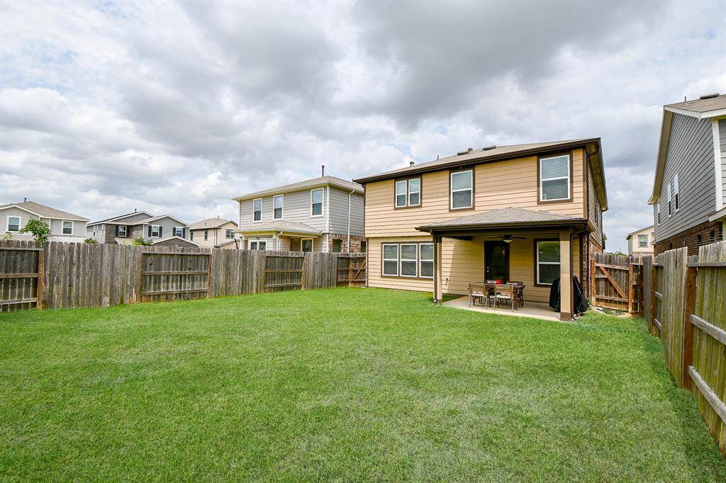 This generously sized backyard offers endless possibilities—whether you're dreaming of summer fun, weekend gatherings, or creating your own outdoor oasis. There's plenty of room to play, relax, garden, or even plan future additions. It’s a space ready to fit your lifestyle.