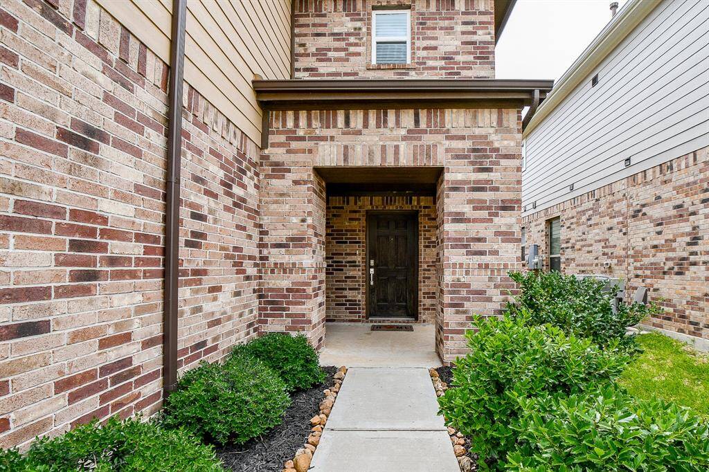 A beautifully landscaped walkway guides you to the front, creating an inviting first impression. The large front porch offers plenty of space to relax and adds a warm, welcoming touch that truly makes you feel at home.