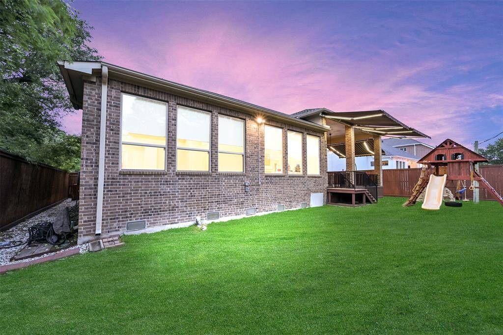 The large yard is highlighted here with plenty of room for a pool.