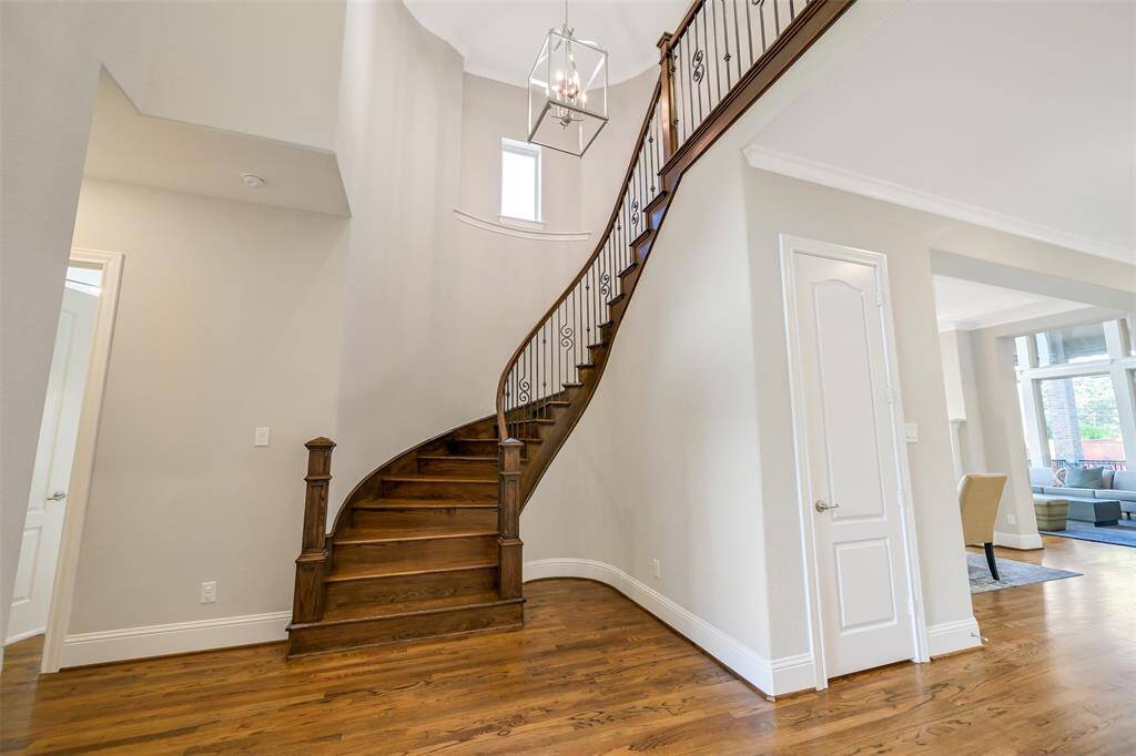 The elegant staircase is an inviting architectural detail.
