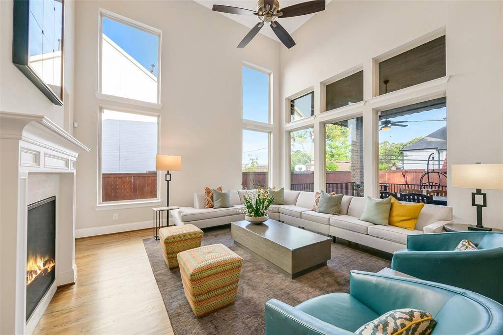 The family room overlooks the covered patio and is centered around a double sided fireplace that is shared with the dining room.