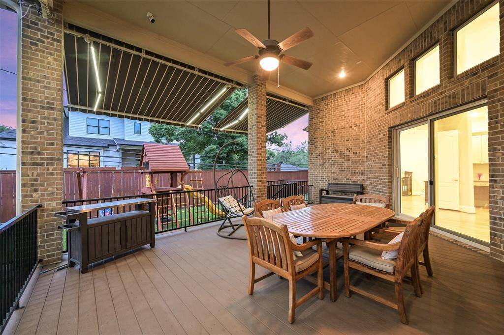 The large covered patio is just off the family room and offers a great place to relax while others play in the expansive yard. There is plenty of room for a grill or summer kitchen. The lighted retractable awnings extend the shade both day and night.