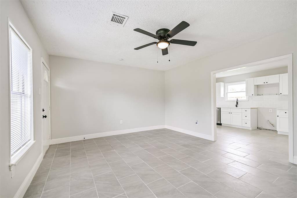 Enjoy an open concept layout with a direct view into the kitchen from the living room, showcasing the home's functional and connected design.