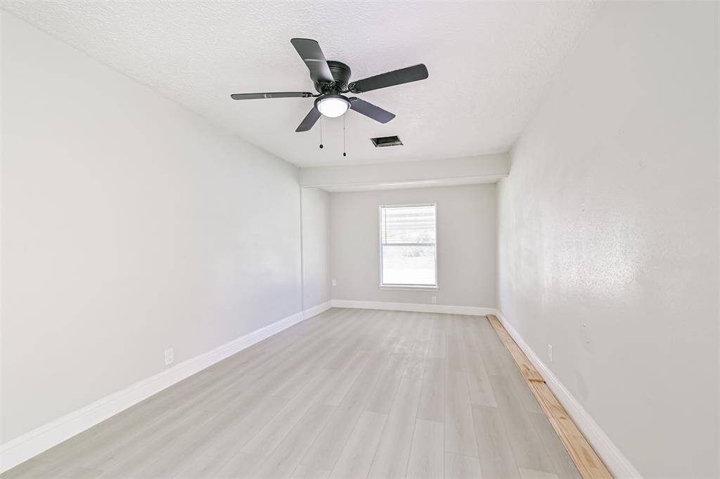 Crisp white trim and soft grey walls add a fresh, clean look throughout all sleeping spaces.