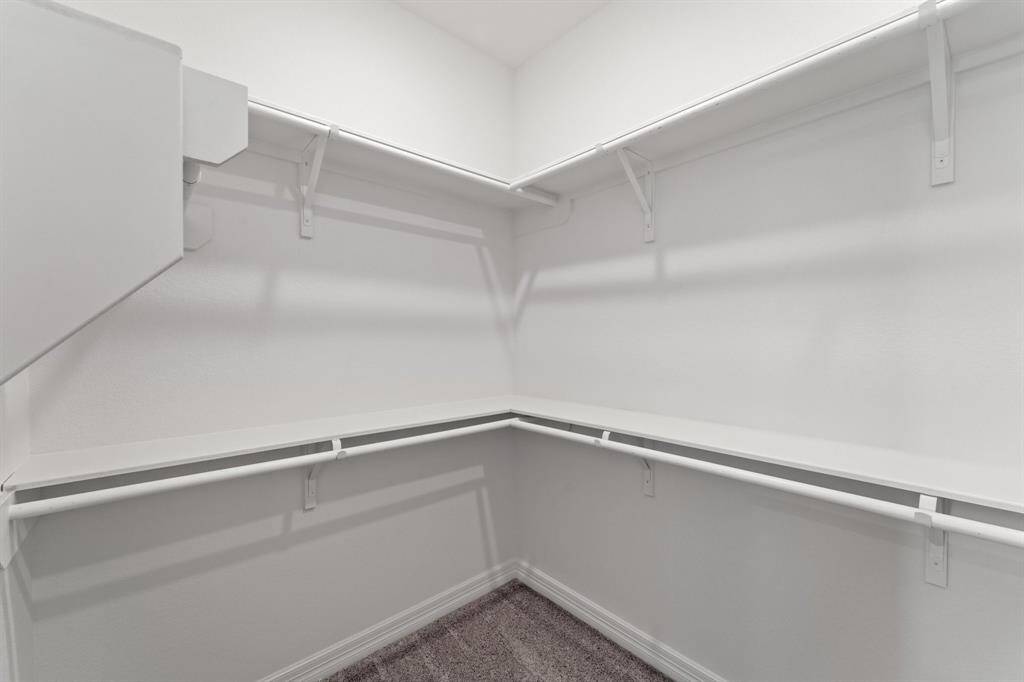 A view of your large primary walk-in Closet
