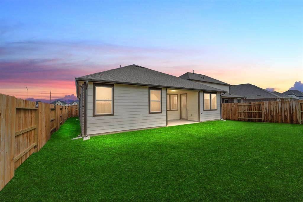 This backyard is perfect for family gatherings, social events, or simply unwinding in the fresh air.