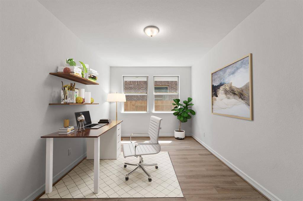 The home office features French doors, beautiful floors, large windows that give a fresh feel, this space promotes focus and creativity.
