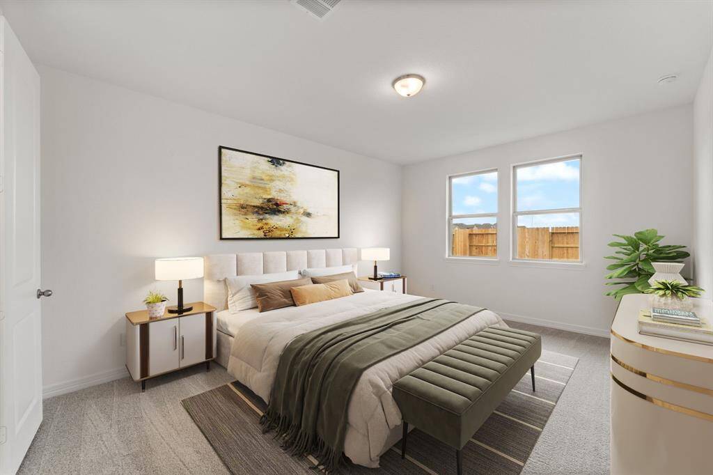 The primary bedroom is generously sized, creating a tranquil and spacious retreat that offers ample room for relaxation. Featuring plush carpet, high ceilings, fresh paint, and large windows that lets in natural lighting throughout the day.
