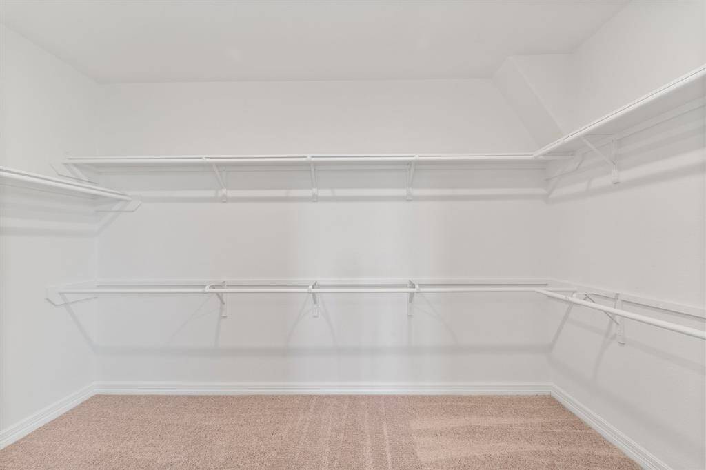 A view of your large primary walk-in Closet