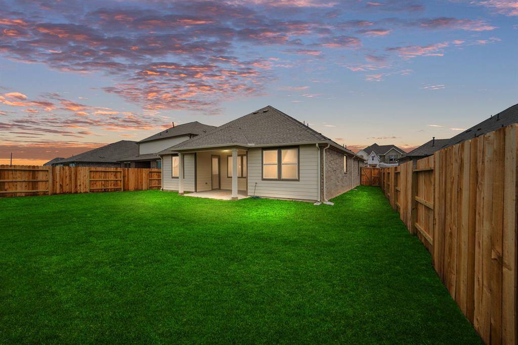 This backyard is perfect for family gatherings, social events, or simply unwinding in the fresh air.