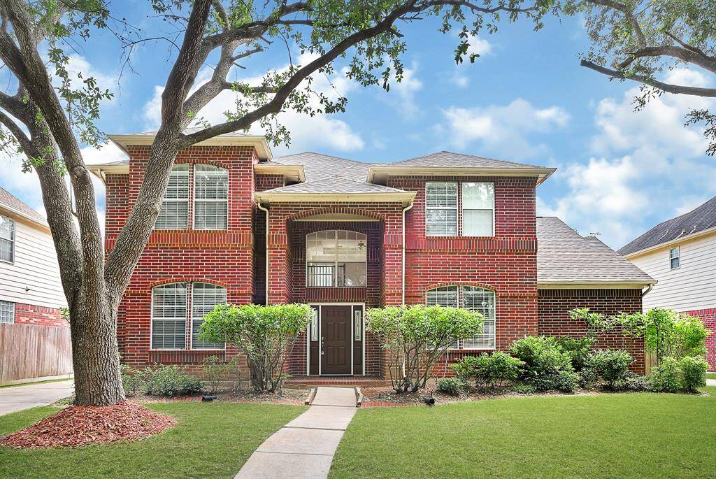 Welcome to 5127 Colony Plantation, Sugar Land — a stunning home with a newly installed roof and beautiful full brick exterior all around. Elegant arched entryway and symmetrical windows create timeless curb appeal, while the inviting front walkway leads to a grand and impressive entrance..
