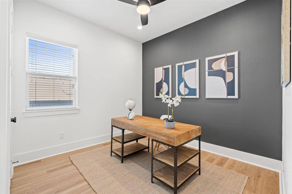 Located on the second (and main) level of the home, this versatile bedroom can serve as an office, guest quarters, or both. It features a remote-operated ceiling fan, an oversized window, and a large closet, making it a multifunctional space. Additionally, an attached full bathroom offers dual access from both the entrance hall and the living area, adding extra convenience and functionality. *All interior photos are from the model home: 5216 Pine Tree*