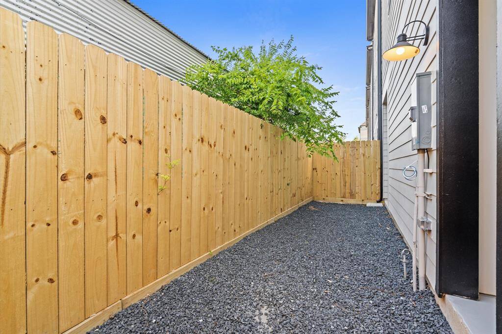 This cozy outdoor space located behind every home is ready to store your sporting equipment, or hold an outdoor grill on weekends! The gravel surface ensures low maintenance, providing a versatile blank canvas for you to personalize and enjoy. *Exterior photo is from the model home: 5216 Pine Tree.*