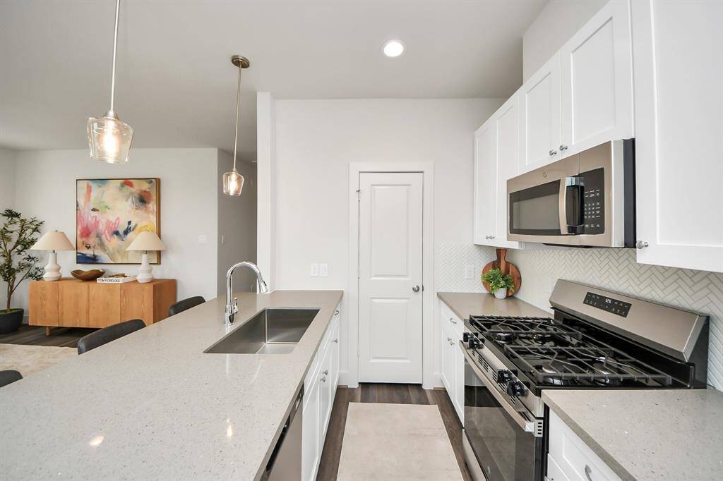 Large pantry behind the door at end of kitchen.
