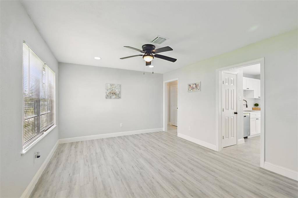 The open-concept floor plan allows for seamless interaction between the kitchen, dining, and living areas—perfect for hosting or keeping an eye on family activities.