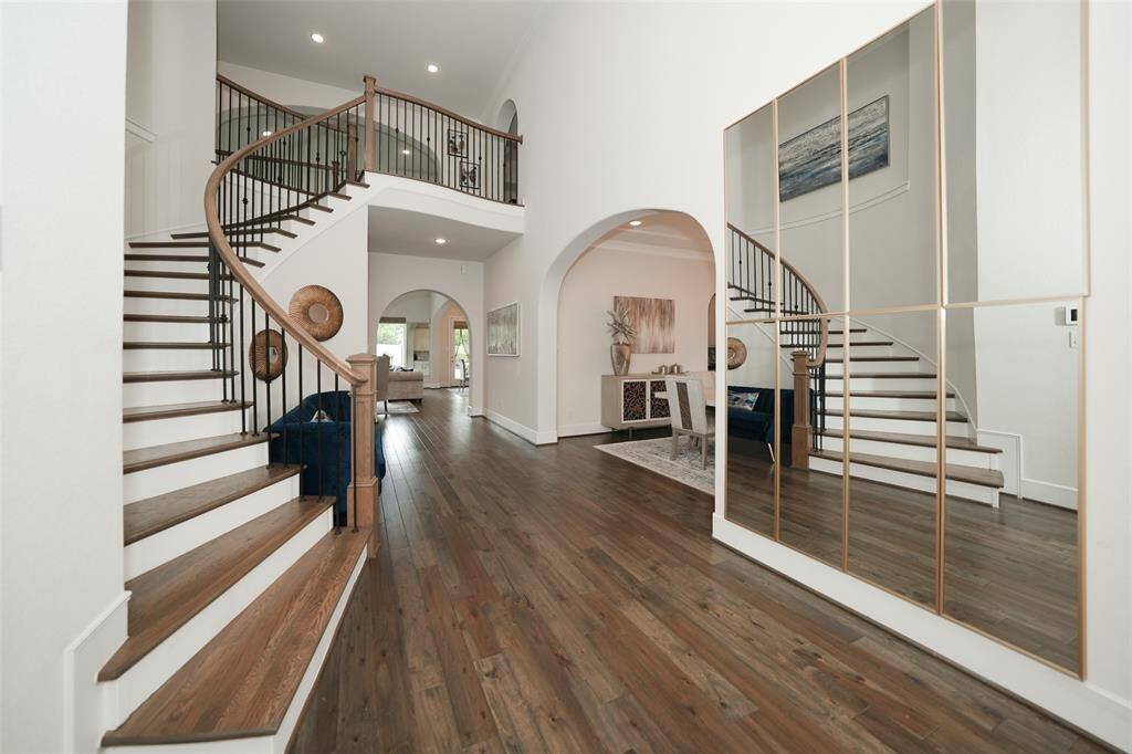 Discover the elegance of this grand entryway, highlighted by a stunning winding staircase that makes an unforgettable first impression.