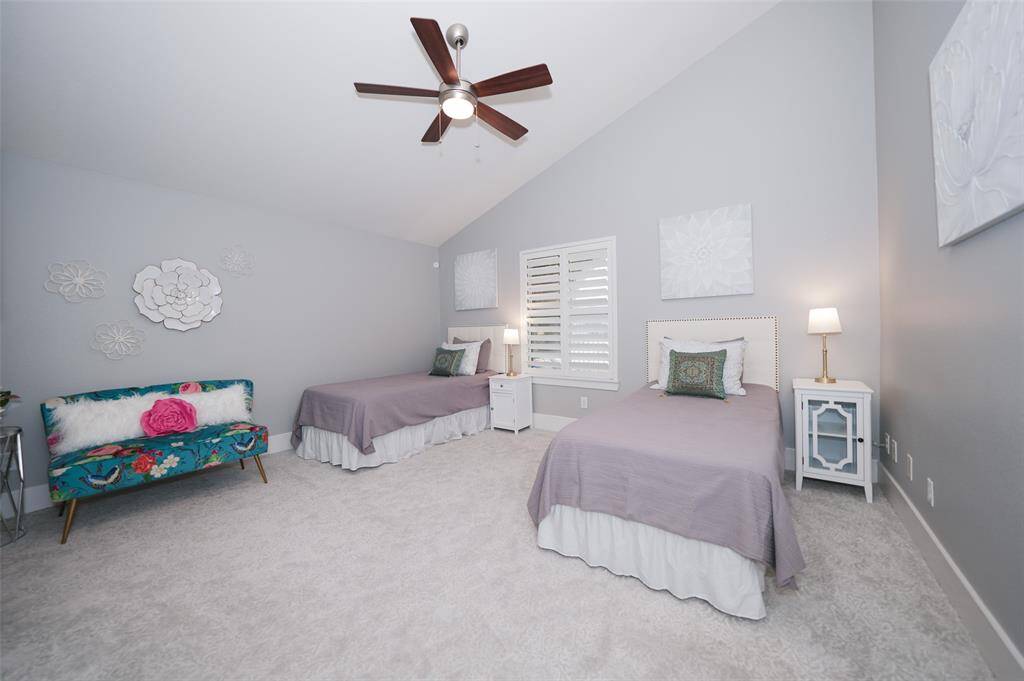 Discover a welcoming guest room on the first floor featuring an ensuite bathroom, walk-in closet, upgraded carpet, and abundant natural light—ideal for visitors or aging parents.