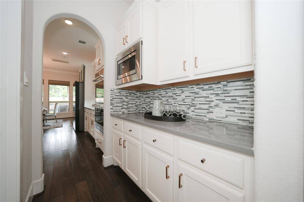 Experience exceptional counter space and abundant storage in this beautifully designed kitchen.