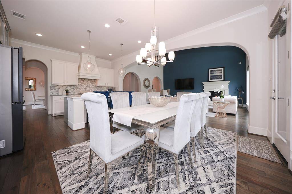 This spacious breakfast nook offers versatility for a secondary dining table or a cozy circular setup.