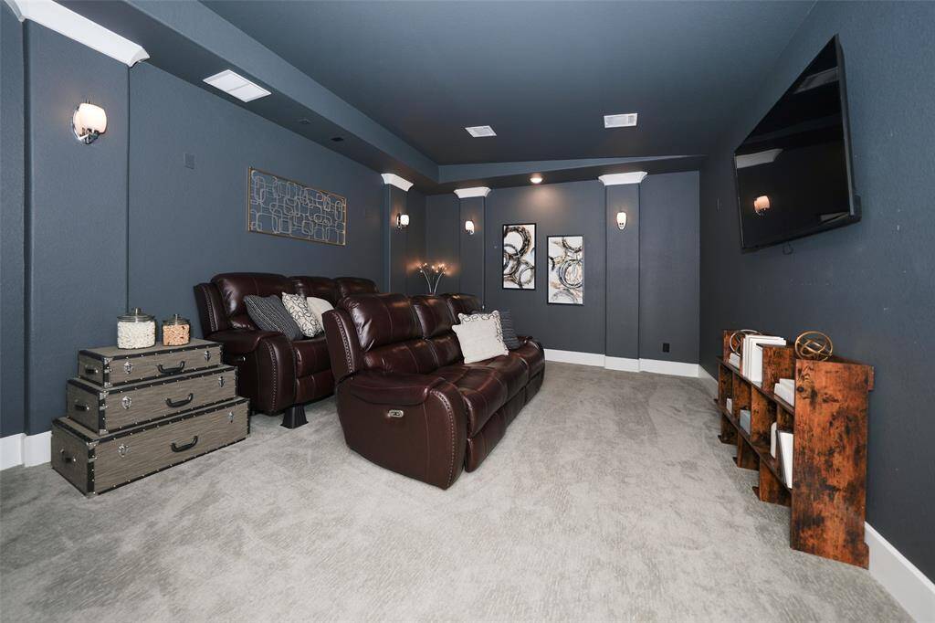 Experience ultimate movie nights in this inviting media room, ideal for creating your own home theater experience.