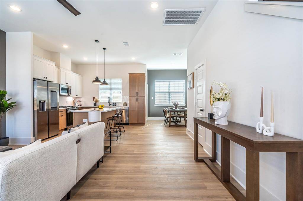 Wide entryway provides ample space for welcoming guests and creating a grand entrance to the home.