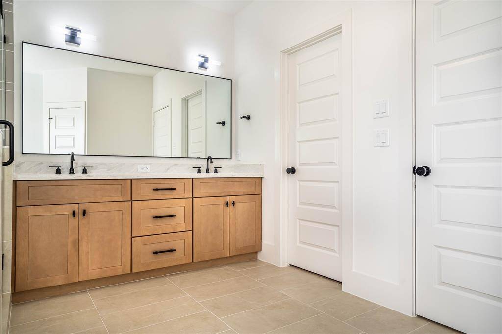 Access to the primary closet from the bathroom