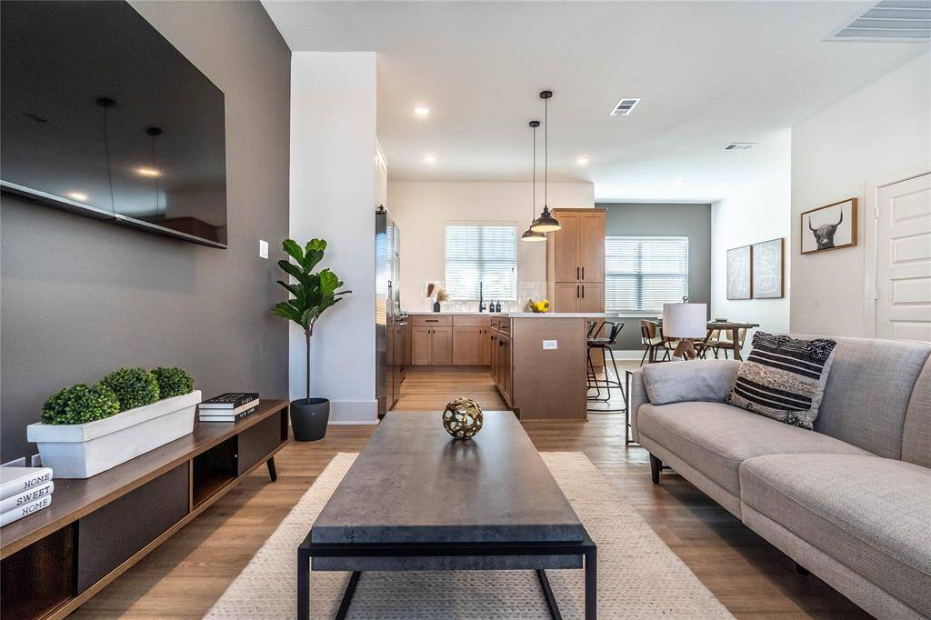 Stunning accent wall in the living room adds a pop of color and personality to the space, creating a focal point