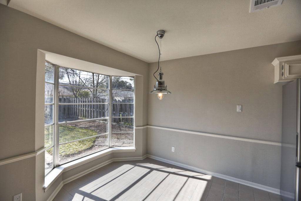 Breakfast room bay windows offer great views of the backyard.