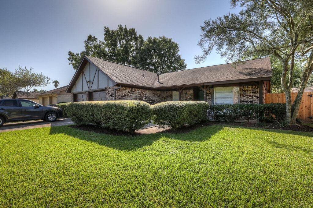 Lush front yard. Boxwoods create a private space for your front porch.