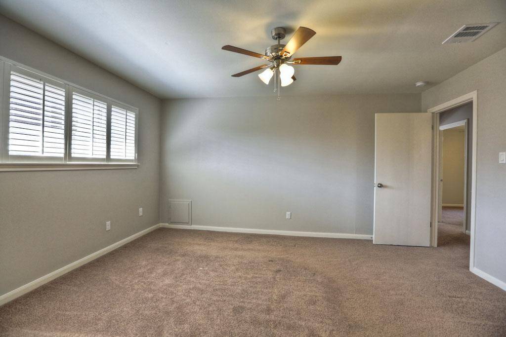 Bedroom number 3 is located at the front of the house on the corner.