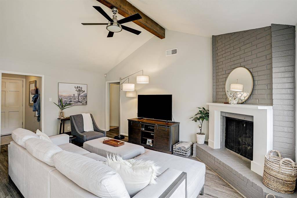 Catheral ceiling adds an airyness to the living room design.