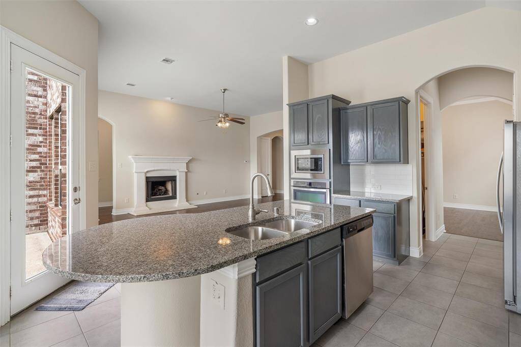 View looking from kitchen towards the backyard and breakfast nook. TONS of windows here!