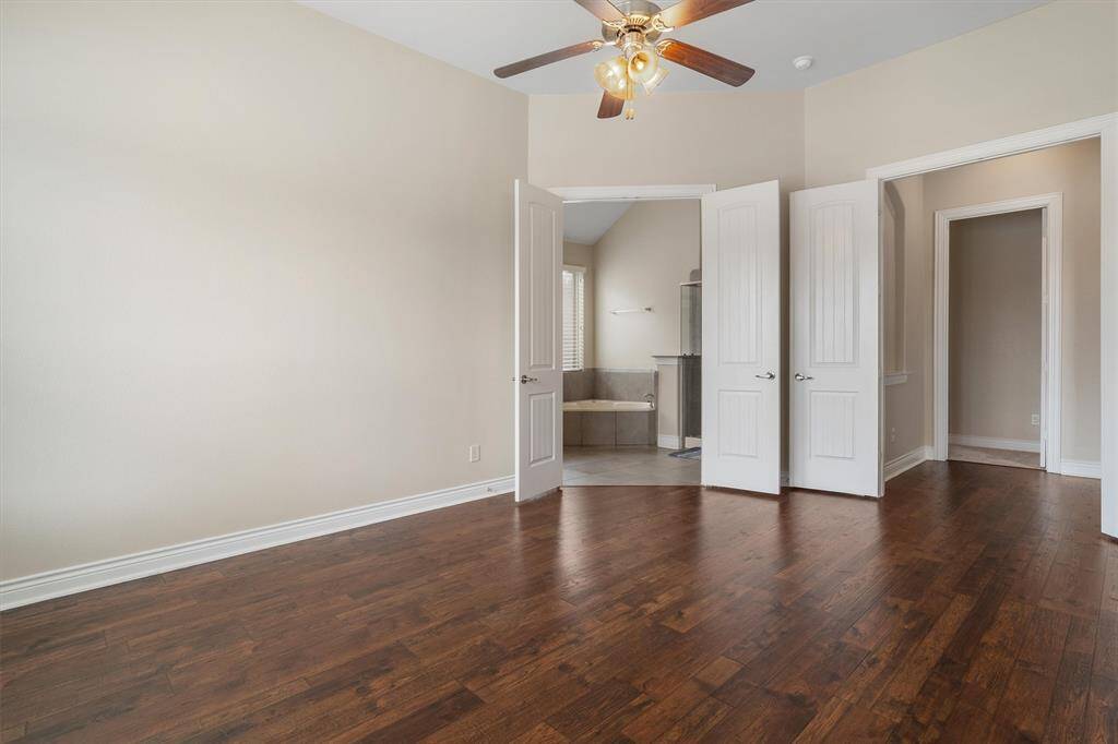 Another view of primary bedroom.