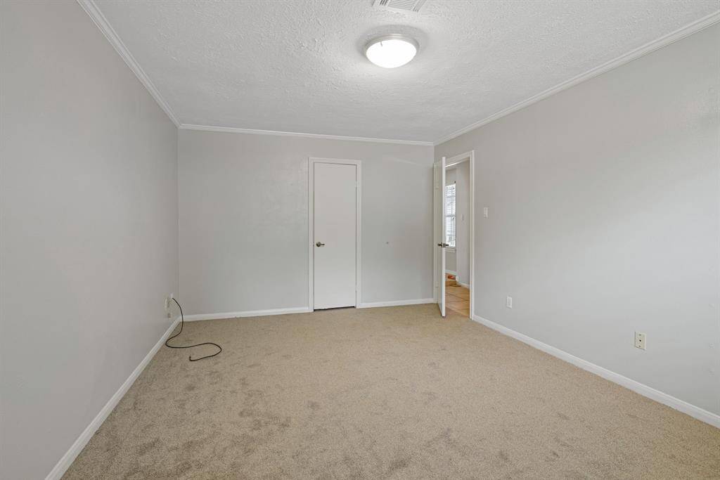 This seconday bedroom is large with a walk in closet.