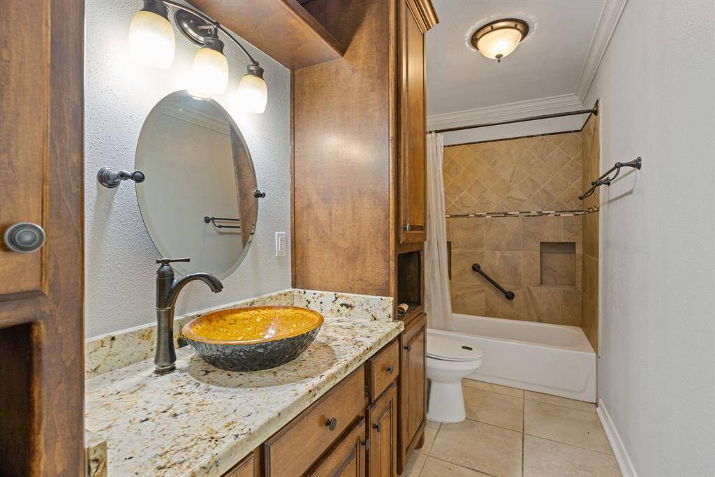 Secondary bathroom with updated cabnetry and plenty of storage.