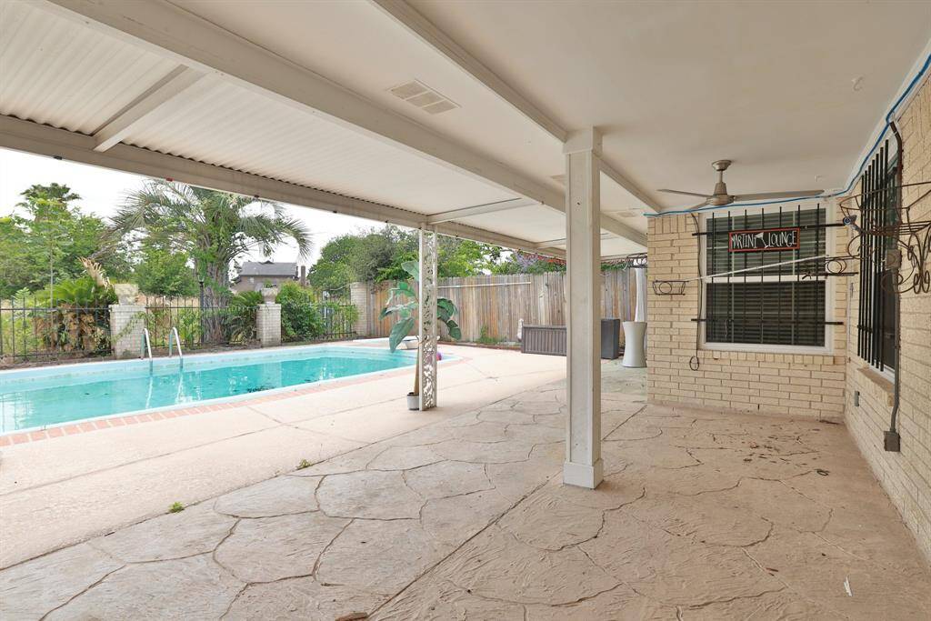 Extend the living space to the huge covered porch outback. Plus the big deep inground pool with diving board.