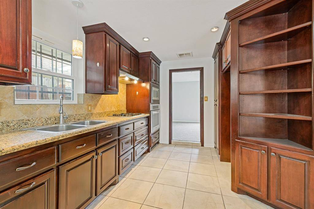 Not only is the kitchen open to the family room, it also has direct access to the dining room/living room.