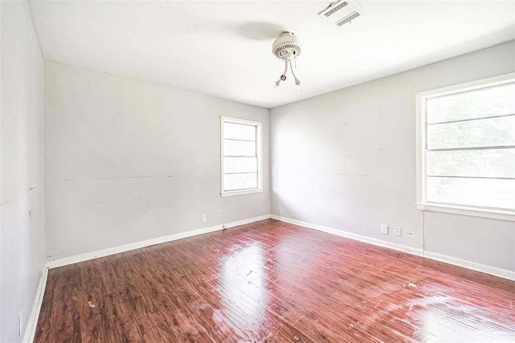 Spacious and bright, this bedroom offers the ideal blank slate for cosmetic upgrades and new window treatments to completely transform this room.