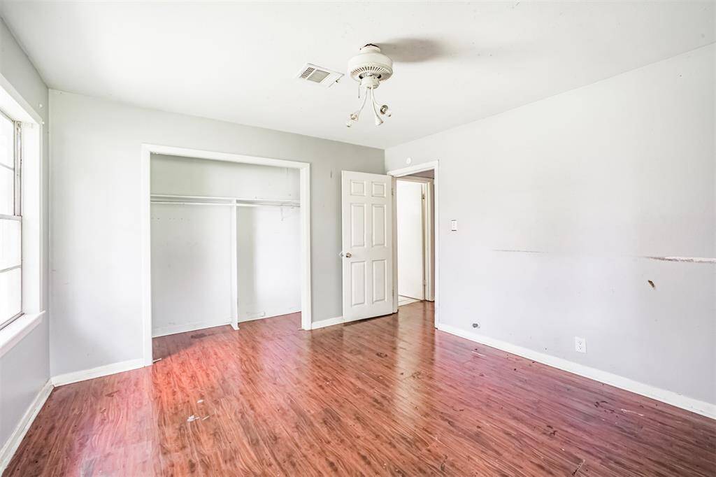 This bedroom includes ample closet space and natural light. An excellent foundation for a primary suite update with upgraded flooring, fresh trim, and modern touches.