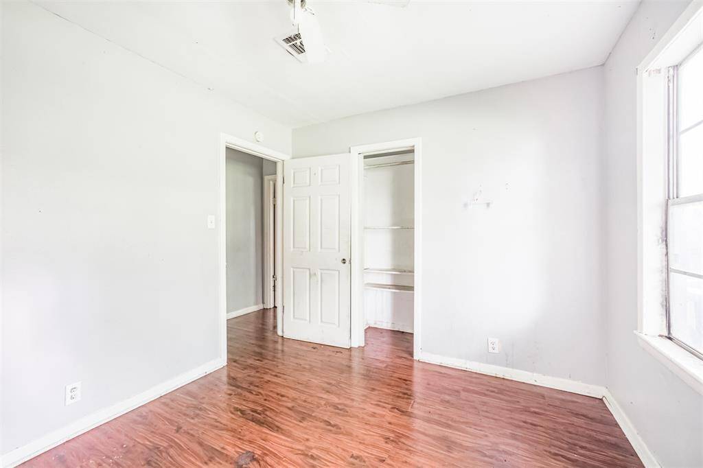 An alternate view reveals ample closet space and quick access to the home's secondary bathroom and main living spaces.