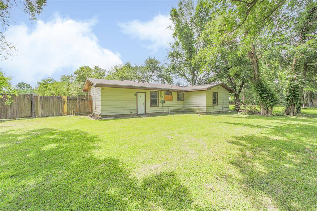 This oversized backyard provides ample room to extend the home, install a pool, or build additional outdoor living areas.