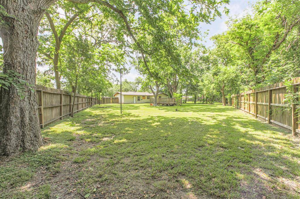 The expansive 14,330 sq. ft. lot offers endless possibilities—from an ADU to a dream garden—surrounded by mature trees and full privacy fencing.