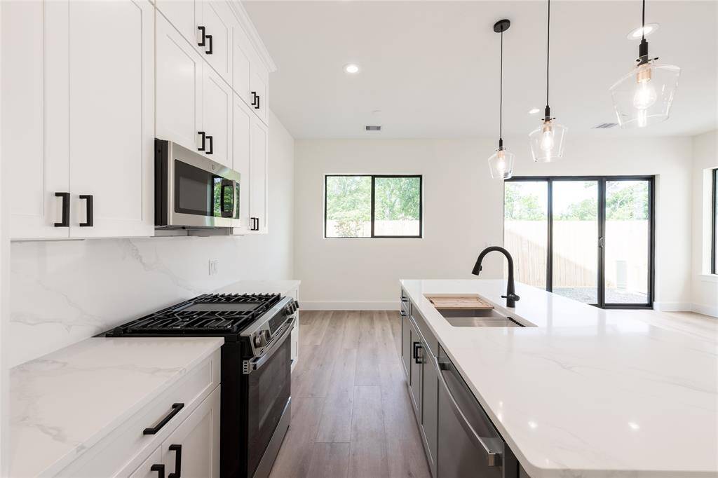 Close-up view of the gorgeous quartz countertops, showcasing their sleek finish—both beautiful and durable.