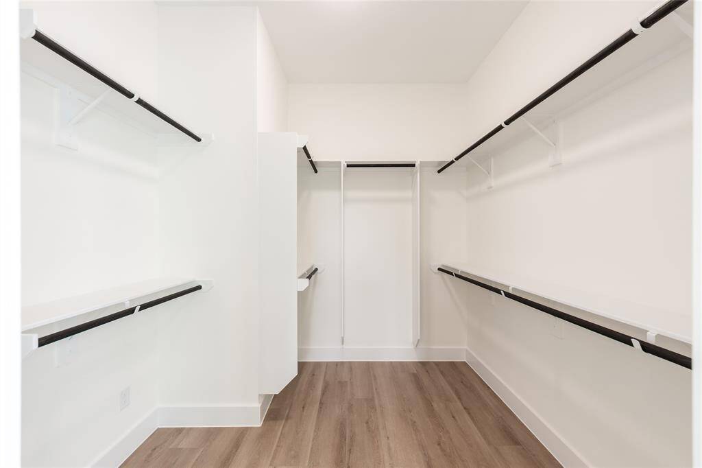 Huge walk-in closet in the primary suite, offering ample space for organization and storage.
