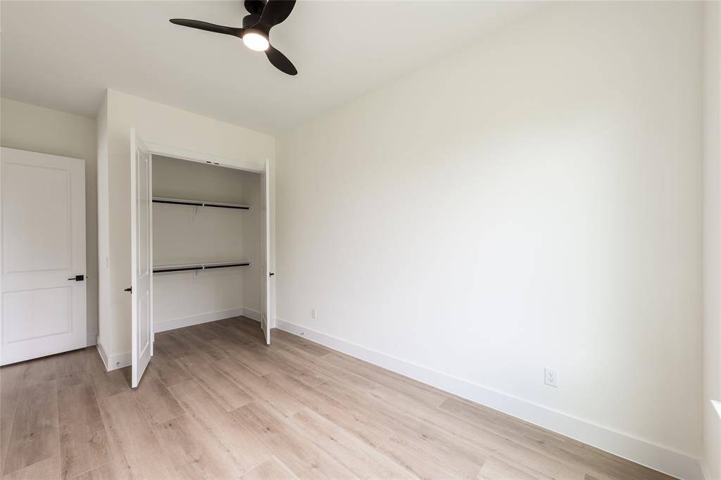 The other spacious secondary bedroom, perfect for guests, a home office, or a cozy retreat.