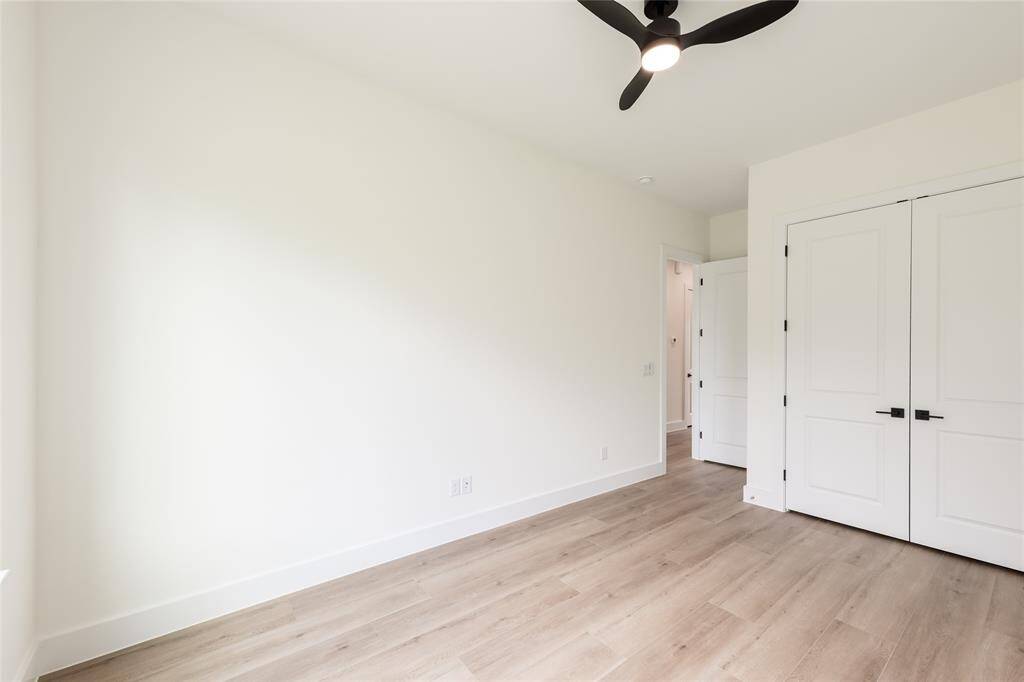 The other spacious secondary bedroom, perfect for guests, a home office, or a cozy retreat.