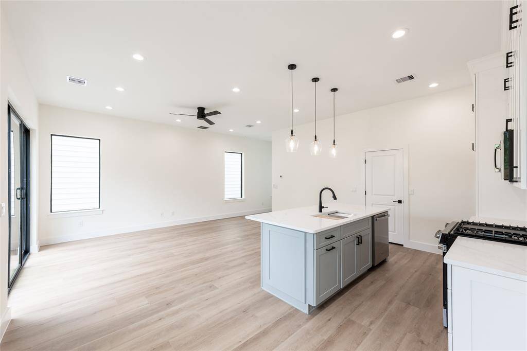 View from the kitchen island reveals the expansive living room—perfect for staying connected while cooking, working, or entertaining.