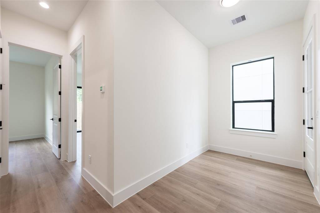 The foyer area is flooded with natural light, creating a warm and welcoming entrance to the home.