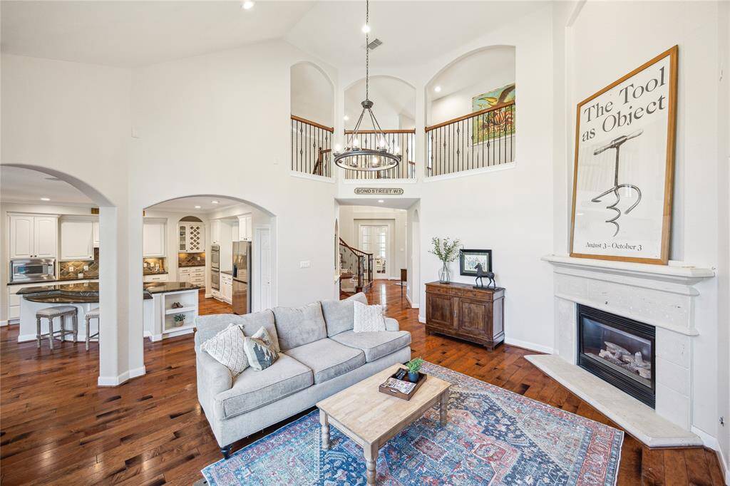 The dramatic 2-story vault is accent with an impressive chandelier.